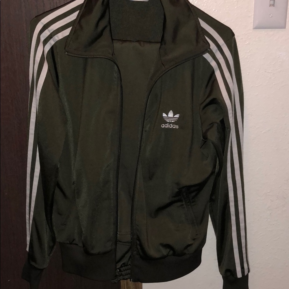 Adidas track suit. Comes with pants and jacket.